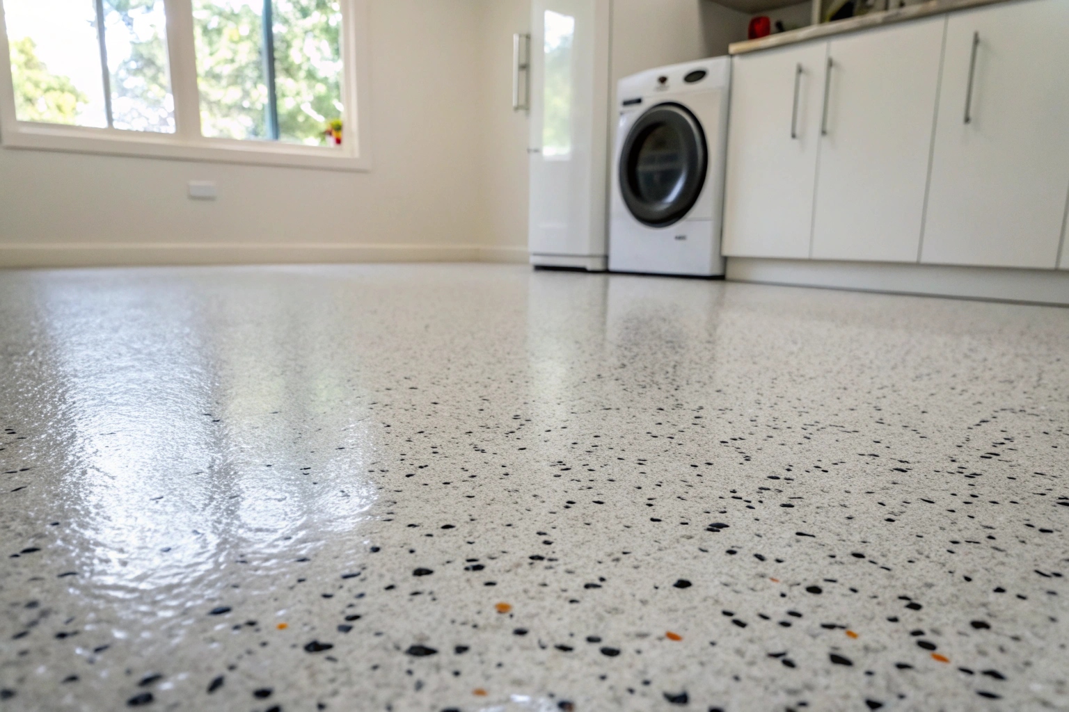 Decorative flake epoxy floor coating in a residential utility area in Salisbury QLD